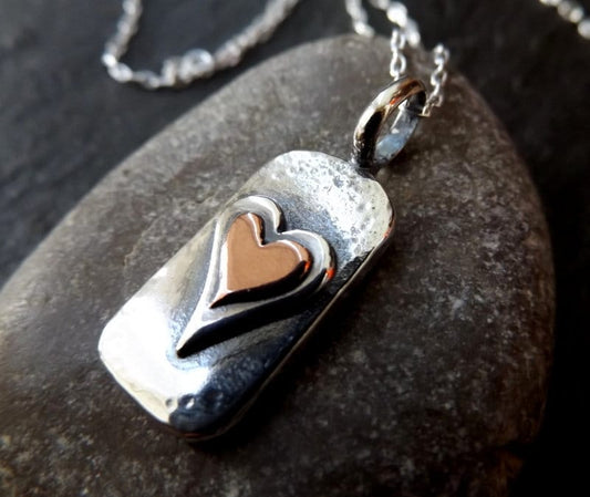 Silver chunky heart necklace , with copper and textured, hammered finish